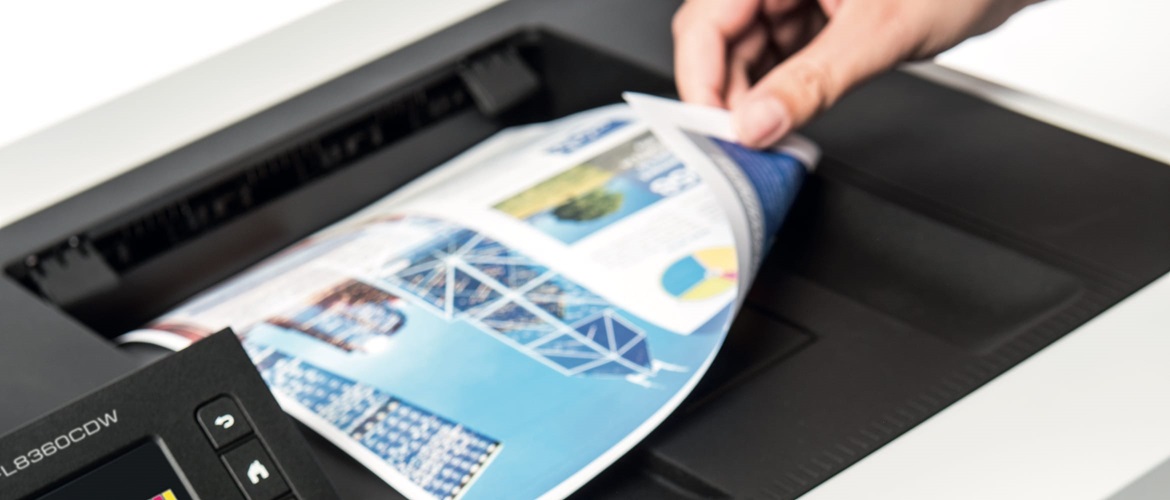 Close-up of a person revealing the underside of a double sided printed document