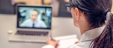 doctor undertakes a video consultation with a patient