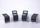 Brother TD-2D series mid volume desktop label printers lined up on a white surface